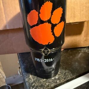 Yeti Black Travel Tumbler with Orange Paw Graphic